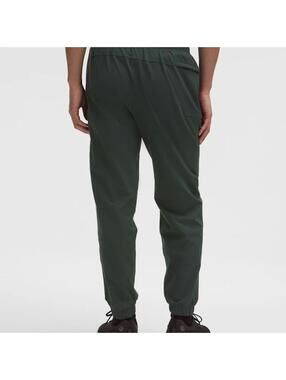 Lululemon Men's Dark Green Jogger Pants with Elastic Cuffs and Zip Pocket